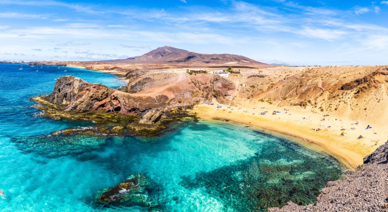 Landscape with turquoise ocean water on Papagayo beach in Lanzarote Spain
